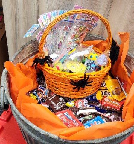 candy and stickers in an orange basket